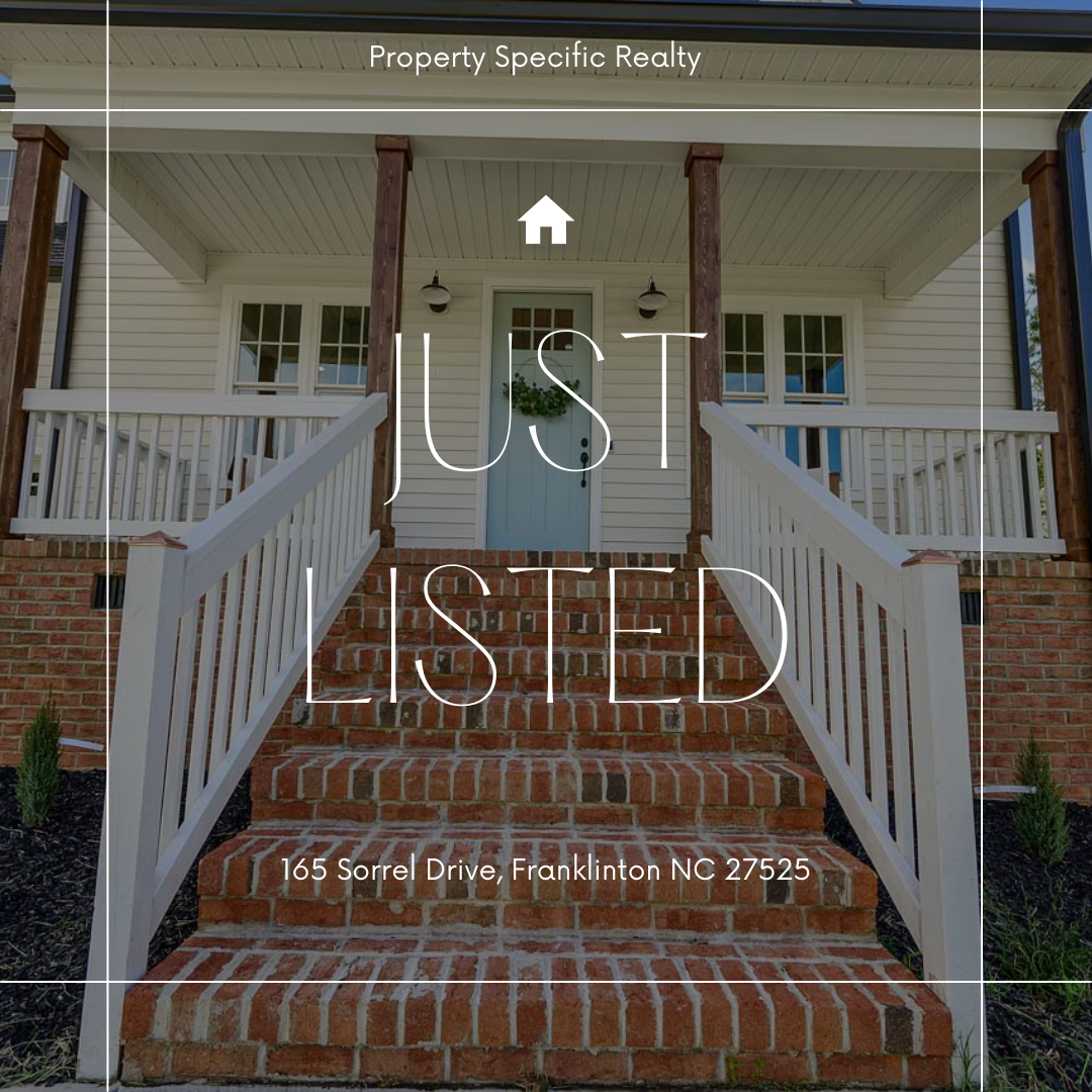 Red brick steps going up to the front porch of a white house in Raleigh.